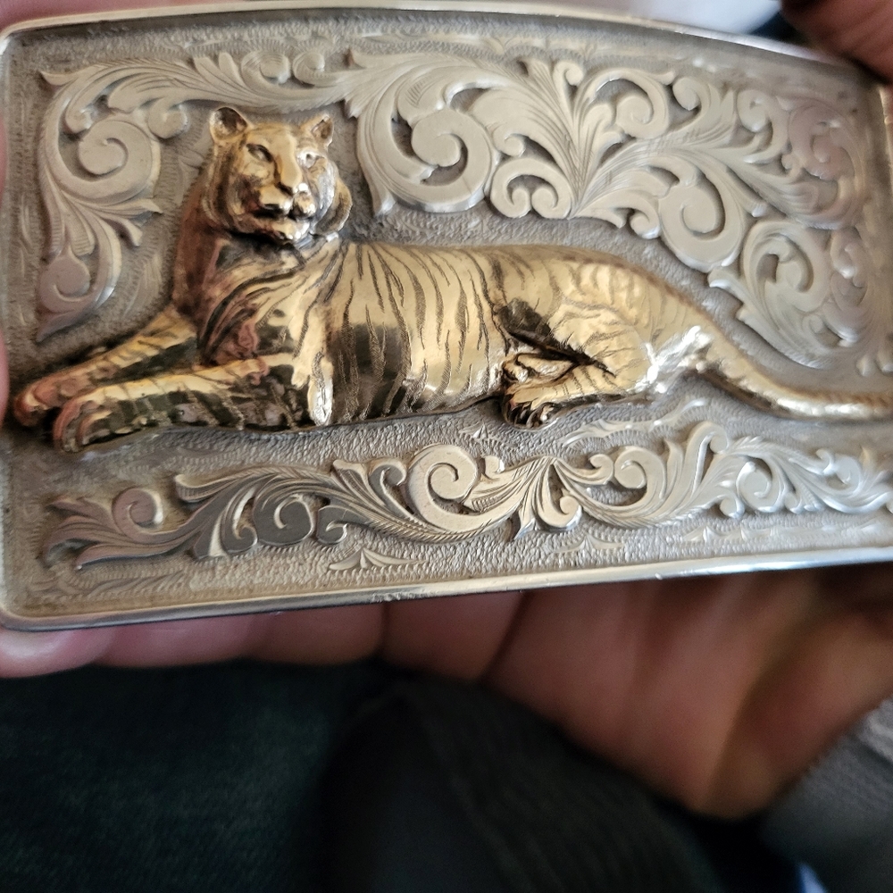 Clint Orms sterling silver 14k buckle...